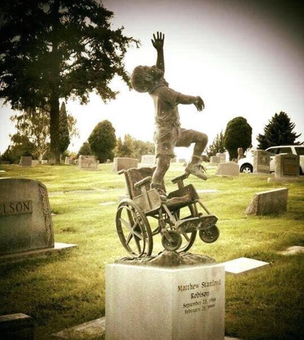 A father erected a tombstone for his deceased son, paralyzed since childhood, where he gets up from a wheelchair and reaches for the sky - Grave, Headstone, Disabled carriage, Cemetery, Father, A son, Paralysis