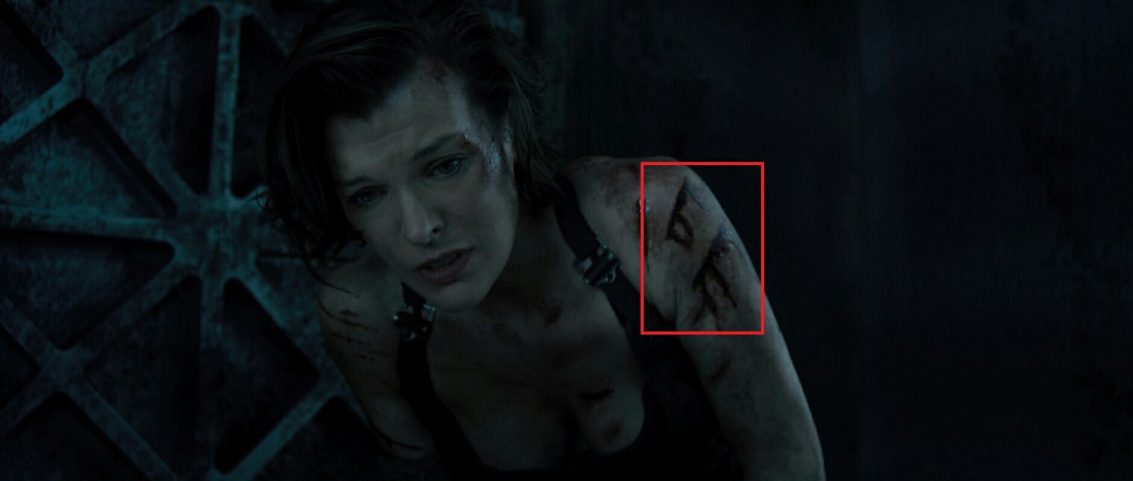 Blood on the arm in the form of the letters B and E - Resident evil, Milla Jovovich